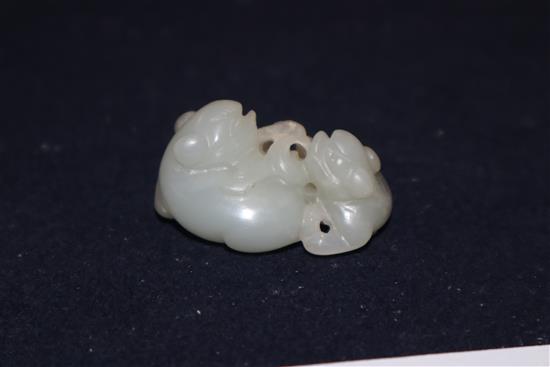 A Chinese carved jade group of two kylin, red lacquered and carved figure of a sage tallest 7cm